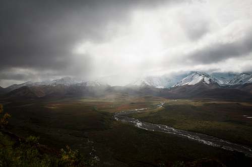 mountain mountain range under white clouds during daytime nature